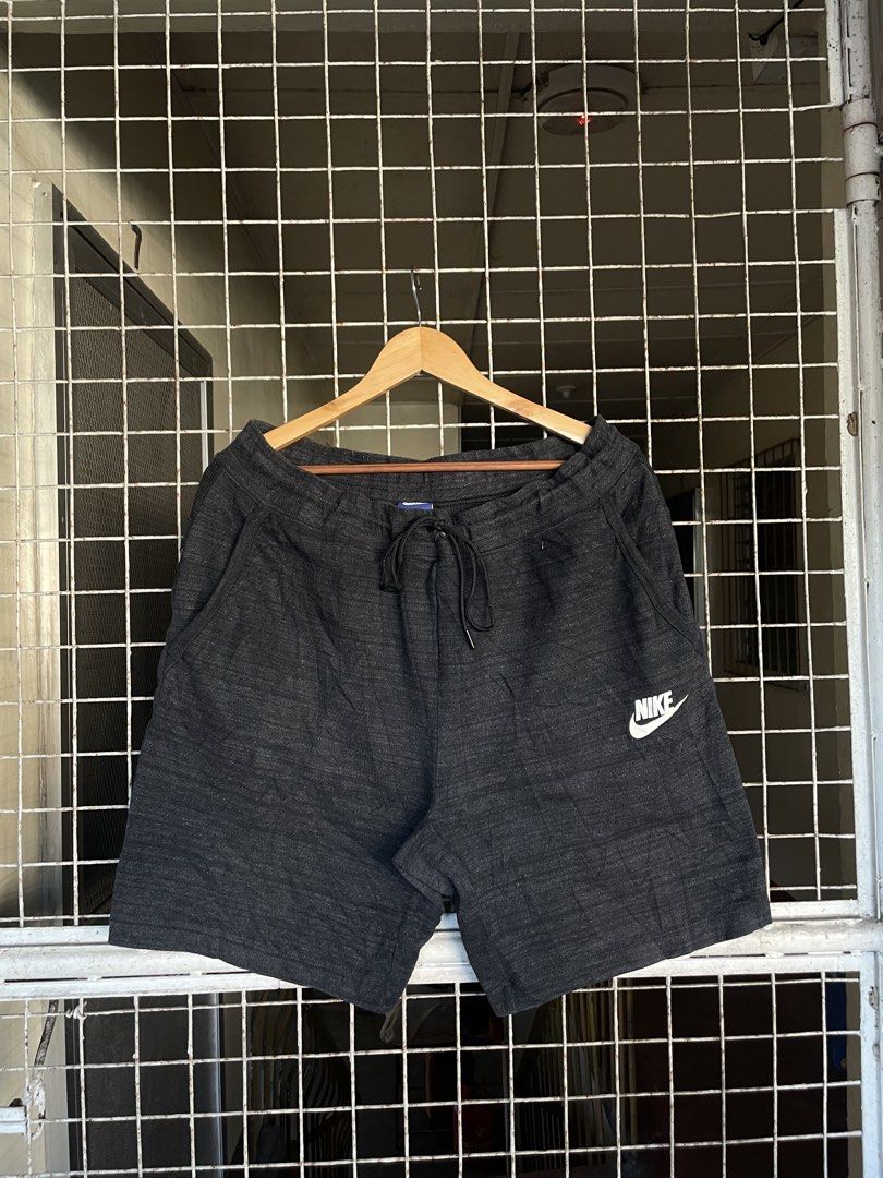 Nike Men's Sportswear Short (Category: Activewear) located in Manila. Submitted by oftherack_04 (Listing ID 1468410316, Image 2). Description: 📌 ITEM DETAILS Brand: Nike Measurements: 36 Waist 21 Lengths Item: Sportswear Shorts Color: Dark Gray / Charcoal Heather Size on Tag: 3XL Design: Heathered gray with white Nike Swoosh logo Waistband: Elastic waistband with adjustable drawstring Pockets: Side pockets Style: Sportswear / Casual / Streetwear
