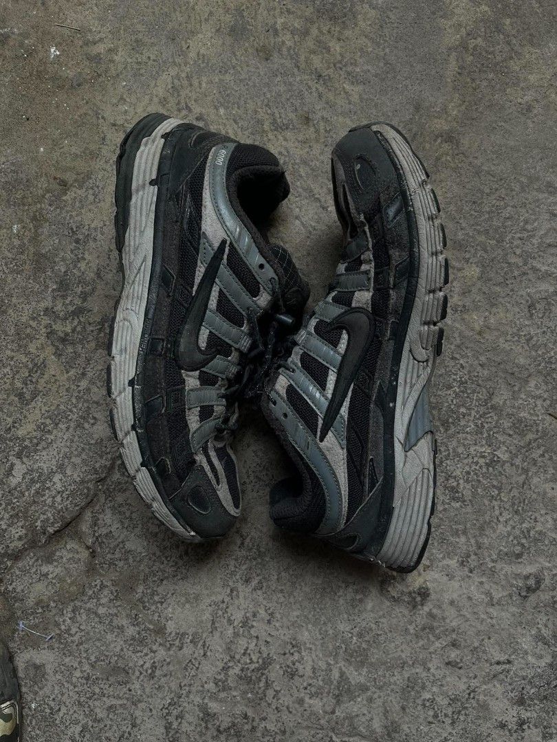 Nike P-6000 Black Grey Running Shoes (Category: Sneakers) located in Manila. Submitted by thrift_ni_pambiii (Listing ID 1468344104, Image 1). Description: - Model: Nike P-6000 - Colorway: Black and Grey - Material: Mixed mesh and synthetic leather overlays - Features: Speed lacing system with toggle locks, padded collar, and durable rubber outsole - Style: Classic retro running silhouette with technical panels.