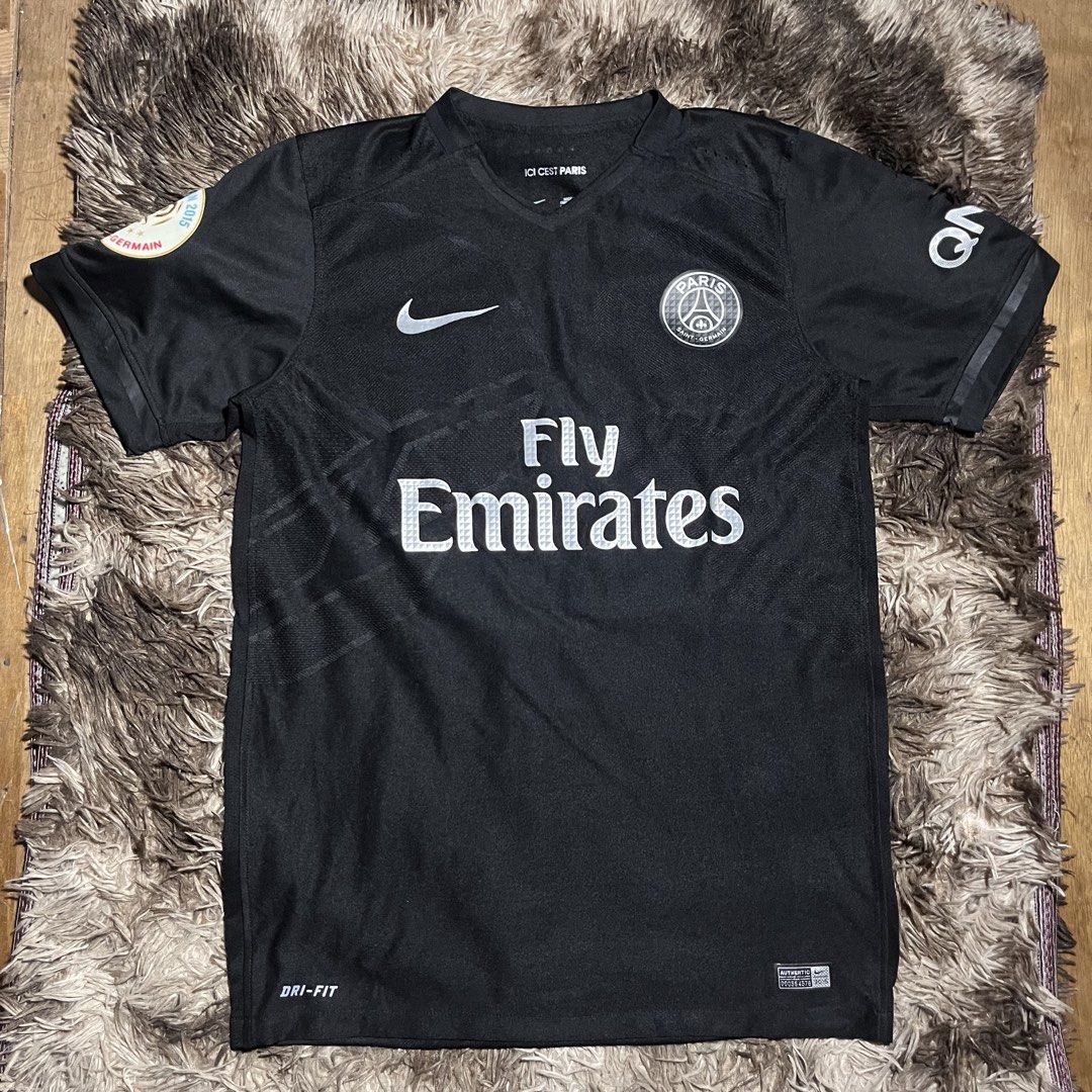 Nike Paris Saint-Germain PSG Black Fly Emirates Jersey (Category: Activewear) located in Manila. Submitted by looted2619 (Listing ID 1468357793, Image 1). Description: NIKE PARIS SAINT GERMAIN Excellent condition Size M color rate: 9.5/10 W 20 L 28 issue:❌ DM FOR MORE DETAILS‼️.