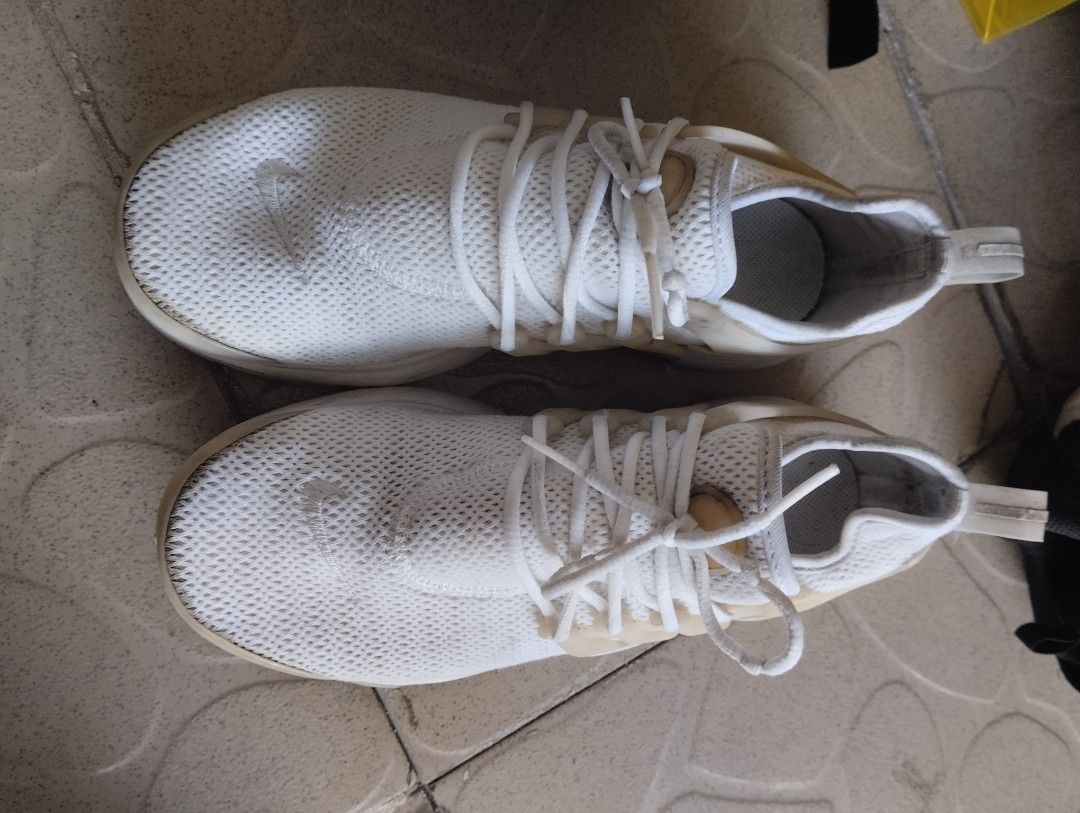 Nike Presto White Sneakers (Category: Sneakers) located in Quezon City. Submitted by teamwhite201808 (Listing ID 1468319654, Image 2). Description: - Brand/Model: Nike Presto sneakers - Color: All white - Material: Breathable mesh upper with signature side cage overlay - Details: Matching white laces, matching sole, readable size tag inside - Condition/Vibe: Lightweight, comfortable, perfect for casual everyday wear NO ISSUE: JUST DUST DIRT..