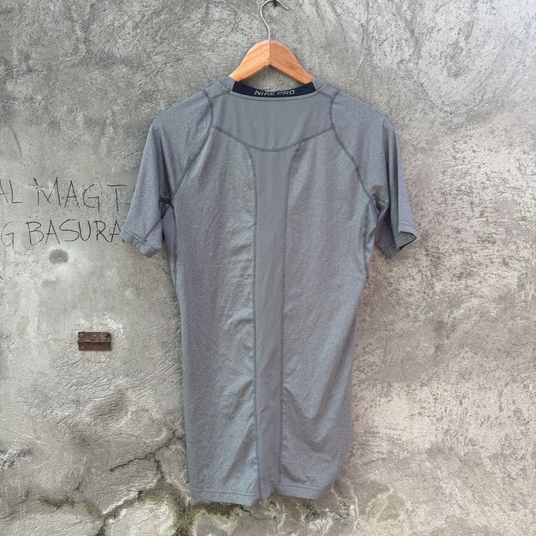Nike Pro Compression Grey T-Shirt Size M (Category: Activewear) located in Caloocan City. Submitted by ayogorenia1002 (Listing ID 1468351198, Image 3). Description: - Brand: Nike Pro - Type: Compression top / Workout shirt - Size: M - Color: Grey - Fit: Standard athletic fit - Material: Stretchy, high-performance fabric - Design: Short sleeves, crew neck, and breathable mesh panel down the center back for ventilation - Condition: Excellent / Read
