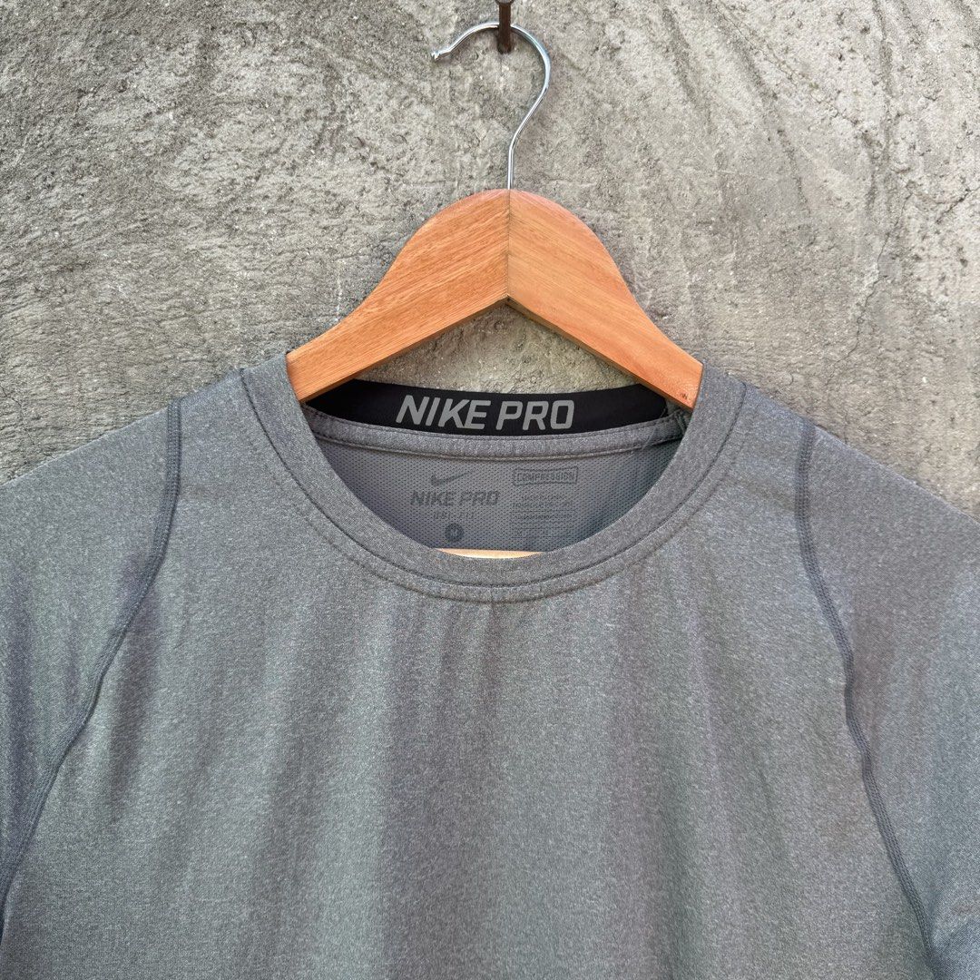 Nike Pro Compression Grey T-Shirt Size M (Category: Activewear) located in Caloocan City. Submitted by ayogorenia1002 (Listing ID 1468351198, Image 2). Description: - Brand: Nike Pro - Type: Compression top / Workout shirt - Size: M - Color: Grey - Fit: Standard athletic fit - Material: Stretchy, high-performance fabric - Design: Short sleeves, crew neck, and breathable mesh panel down the center back for ventilation - Condition: Excellent / Read