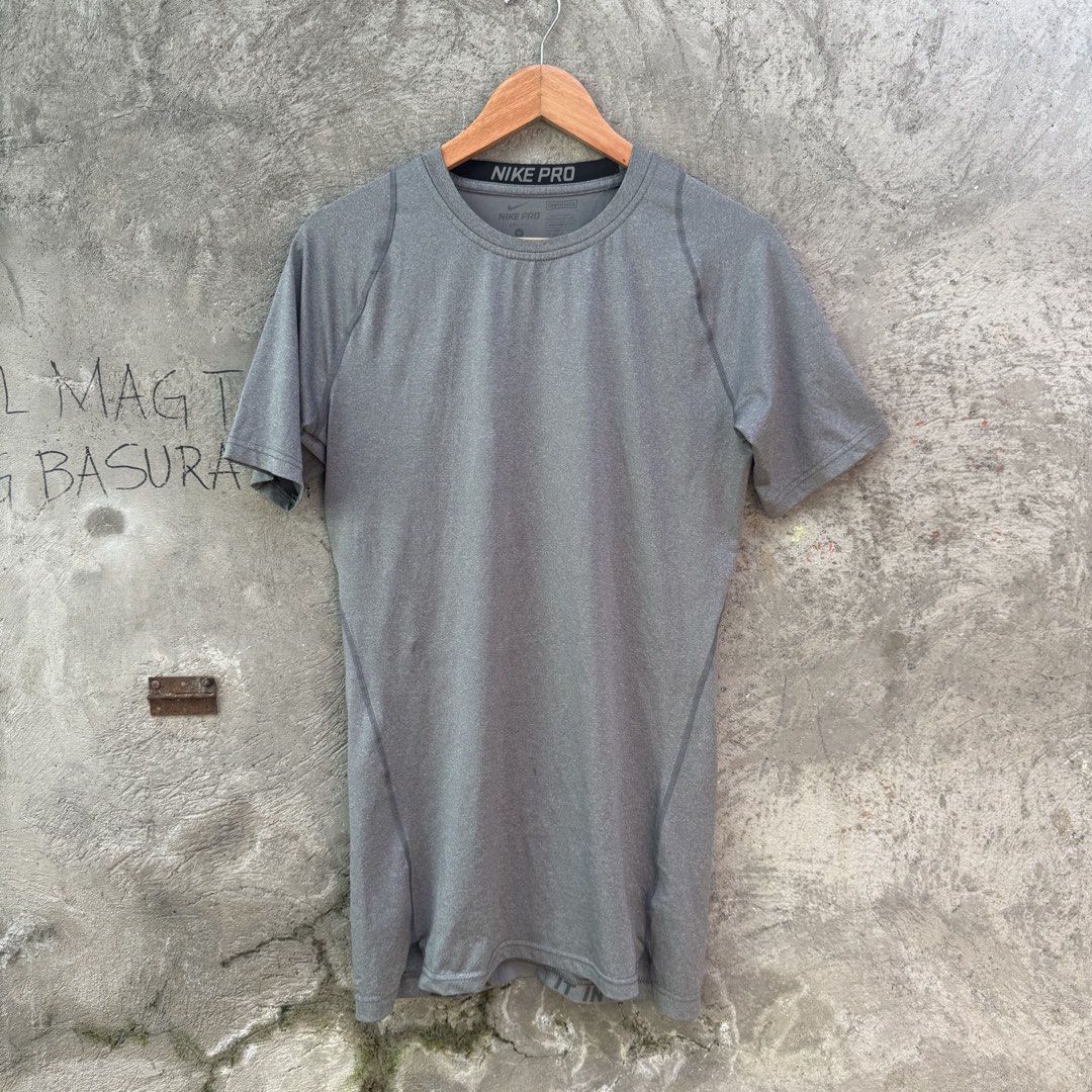 Nike Pro Compression Grey T-Shirt Size M (Category: Activewear) located in Caloocan City. Submitted by ayogorenia1002 (Listing ID 1468351198, Image 1). Description: - Brand: Nike Pro - Type: Compression top / Workout shirt - Size: M - Color: Grey - Fit: Standard athletic fit - Material: Stretchy, high-performance fabric - Design: Short sleeves, crew neck, and breathable mesh panel down the center back for ventilation - Condition: Excellent / Read