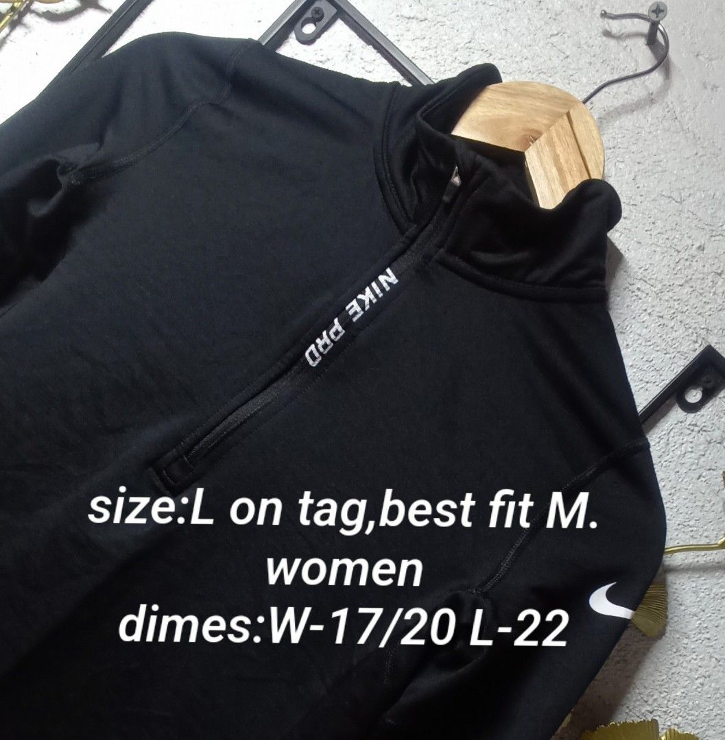 Nike Pro Hyperwarm Quarter Zip (Category: Activewear) located in Kawit. Submitted by deidzdzn (Listing ID 1468327246, Image 2). Description: - Brand: Nike Pro Hyperwarm - Color: Black with white accents - Size: Tagged L, fits like a Medium (Width: 17/20 inches, Length: 22 inches) - Design: White Nike Pro lettering along the front zipper and white swoosh logo on the sleeve - Interior: Comfortable ribbed lining for extra warmth - Condition: Great w