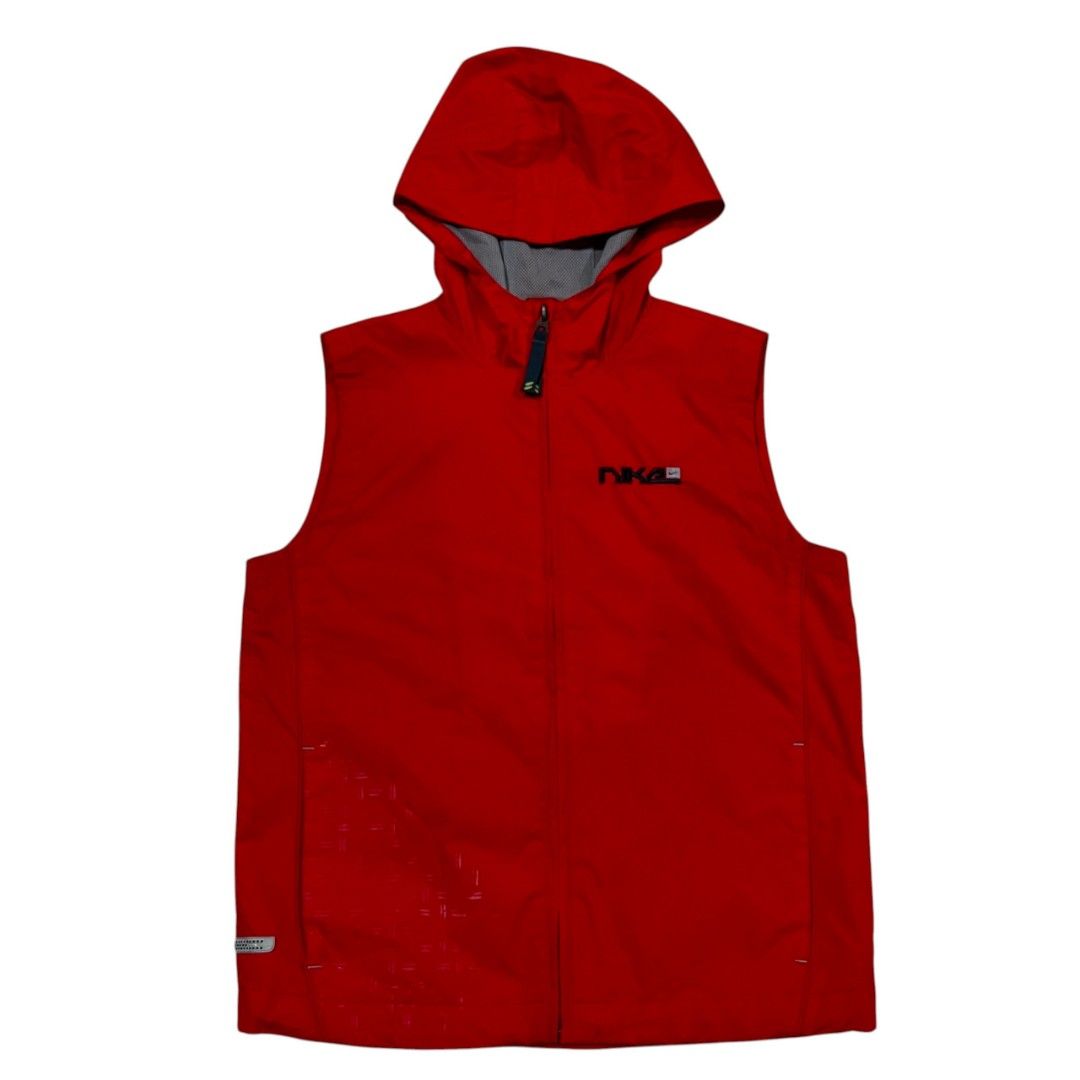Nike Red Hooded Zip-Up Vest (Category: Tshirts & Polo Shirts ) located in Cagayan de Oro. Submitted by lootfindzzzz (Listing ID 1468355646, Image 1). Description: - Brand: Nike - Color: Bright red with grey hood lining and dark blue zipper pull - Design: Sleeveless vest, full zip closure, and built-in hood - Details: Small Nike logo on upper left chest, faint graphic pattern near bottom right hem, two side pockets with white stitching - Condition