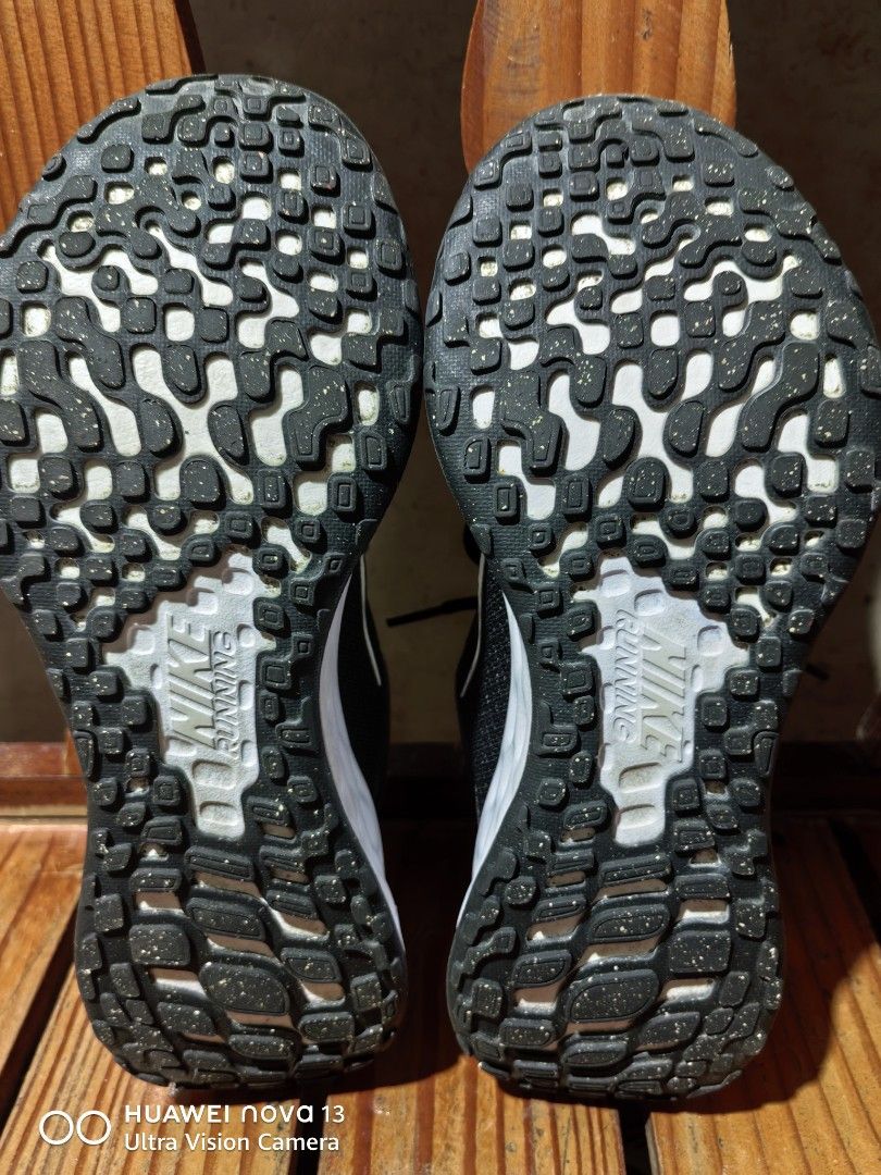 Nike Revolution Running Shoes Black White (Category: Sneakers) located in Cebu City. Submitted by abellarces30419 (Listing ID 1468342782, Image 2). Description: Black and white Nike running shoes. Original Mesh upper keeps things breathable. Thick foam midsole for good cushioning. Durable rubber outsole with Nike Running text pattern underneath. Black laces and white Swoosh logo on the sides. Very lightweight and comfy for daily jogs or walking a