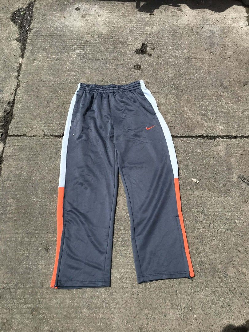 Nike track sweater pants (Category: Chinos) located in Manila. Submitted by thriftnicarl.3 (Listing ID 1468449575, Image 2). Description: waist - 30 to 34 length - 39.4 thigh - 14 leg open - 9.2 price - 449 Freeship via jnt.