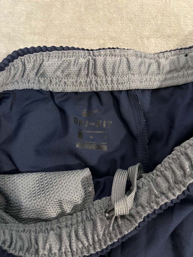 Nike woven cropped track pants short (Category: Shorts) located in Manila. Submitted by zenwind_3cdc42 (Listing ID 1468404161, Image 3). Description: Nike woven 3/4 cropped track pants/shorts in excellent condition • Navy Blue 10/10 Color rate • Complete Care tags • Shipping thru j&t // door to door • DM for details reply ako sa isang account :)).