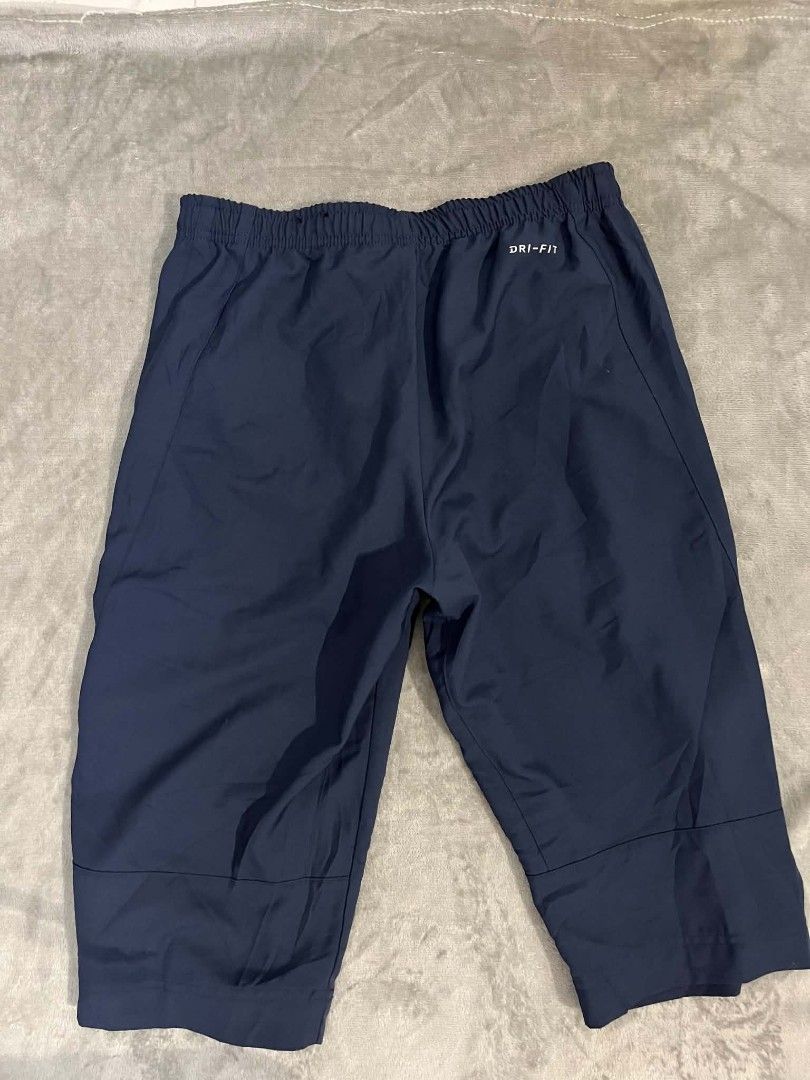 Nike woven cropped track pants short (Category: Shorts) located in Manila. Submitted by zenwind_3cdc42 (Listing ID 1468404161, Image 2). Description: Nike woven 3/4 cropped track pants/shorts in excellent condition • Navy Blue 10/10 Color rate • Complete Care tags • Shipping thru j&t // door to door • DM for details reply ako sa isang account :)).