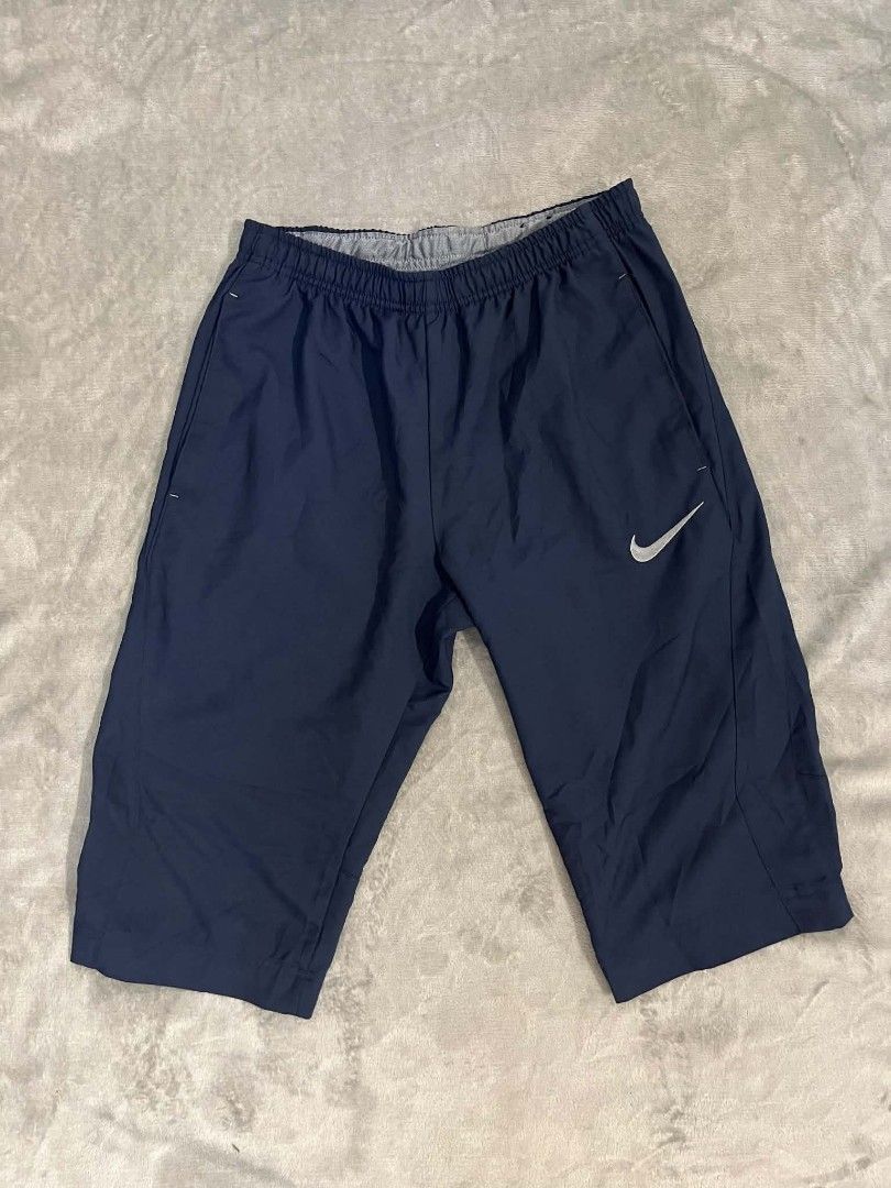 Nike woven cropped track pants short (Category: Shorts) located in Manila. Submitted by zenwind_3cdc42 (Listing ID 1468404161, Image 1). Description: Nike woven 3/4 cropped track pants/shorts in excellent condition • Navy Blue 10/10 Color rate • Complete Care tags • Shipping thru j&t // door to door • DM for details reply ako sa isang account :)).