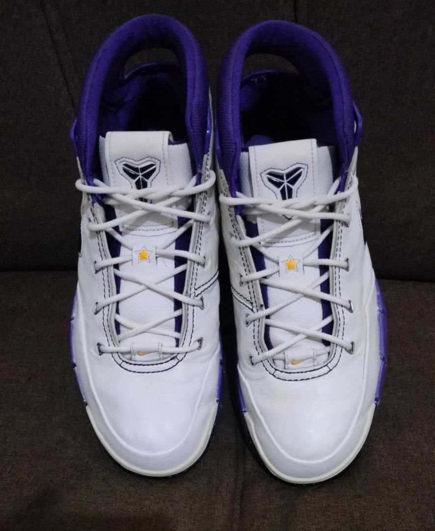Nike Zoom Kobe 1 81 pts (Category: Sneakers) located in Caloocan City. Submitted by amzki15 (Listing ID 1468073233, Image 2). Description: - Model: Nike Zoom Kobe 1 - Colorway: White, purple, and black swoosh - Design: Classic mid-top cut with signature Kobe logo on the tongue - Performance: Responsive Zoom Air cushioning and durable herringbone traction pattern - Material: Premium upper leather with a subtle textured finish - Condition: Soles sh