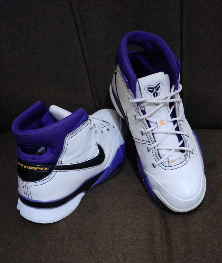 Nike Zoom Kobe 1 81 pts (Category: Sneakers) located in Caloocan City. Submitted by amzki15 (Listing ID 1468073233, Image 1). Description: - Model: Nike Zoom Kobe 1 - Colorway: White, purple, and black swoosh - Design: Classic mid-top cut with signature Kobe logo on the tongue - Performance: Responsive Zoom Air cushioning and durable herringbone traction pattern - Material: Premium upper leather with a subtle textured finish - Condition: Soles sh