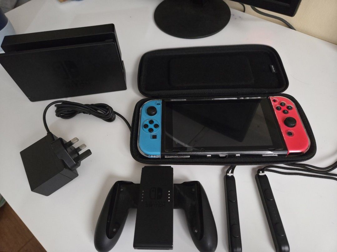Nintendo Switch Neon Blue and Neon Red Console (Category: Nintendo) located in San Fernando. Submitted by only_fons (Listing ID 1468309477, Image 1). Description: - Complete Nintendo Switch system with vibrant Neon Blue and Neon Red Joy-Cons - Includes TV dock, power adapter, Joy-Con grip, HDMI cable, and two wrist straps - Comes with a durable black carrying case for easy travel - Extra protection provided by a pre-installed clear plastic shell 
