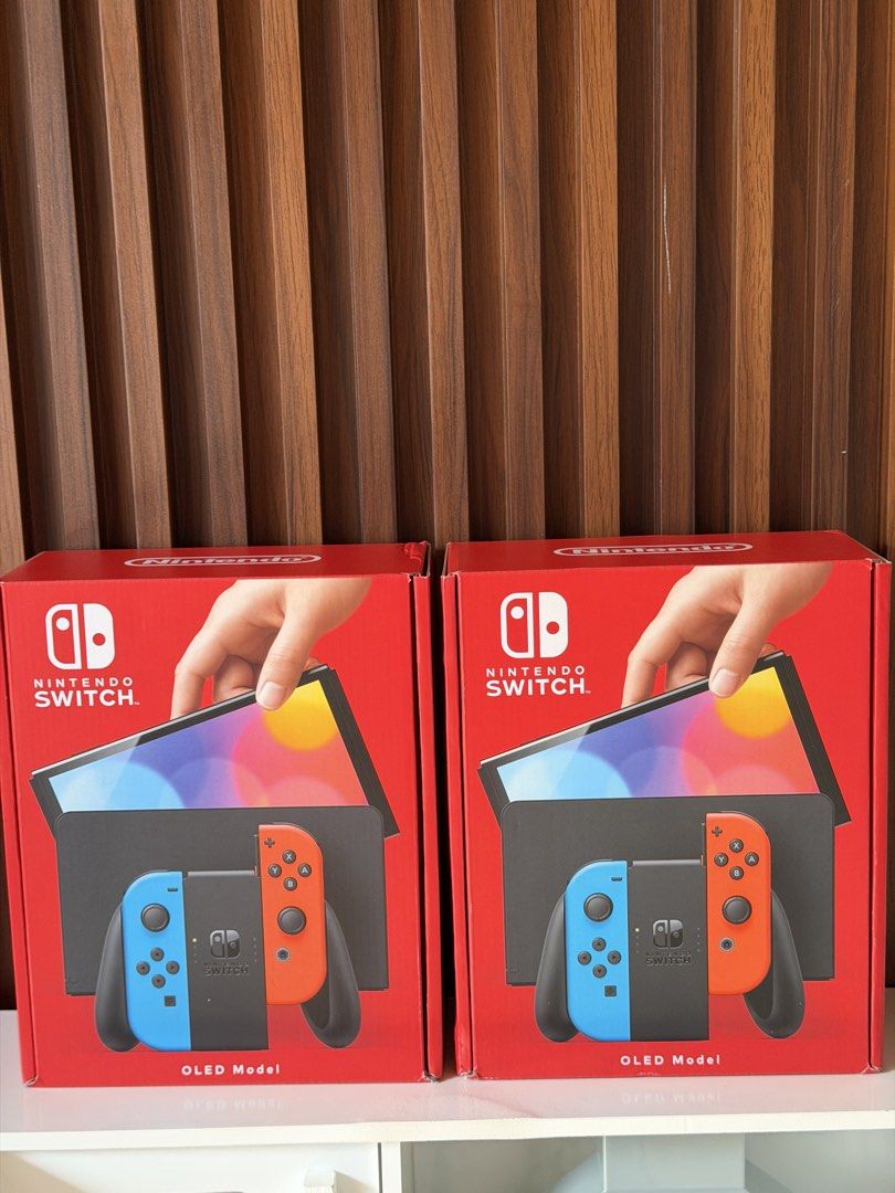 Nintendo Switch OLED Model Neon Blue and Neon Red (Category: Nintendo) located in Caloocan City. Submitted by acvalloyas (Listing ID 1468455638, Image 1). Description: - Brand new & 100% unopened Nintendo Switch OLED (Neon Blue / Neon Red Joy-Cons) - Official Southeast Asia (SEA) set with 2-year warranty stickers on the box - Serial numbers clearly printed on the back for your peace of mind - Complete standard bundle includes: Nintendo Switch con