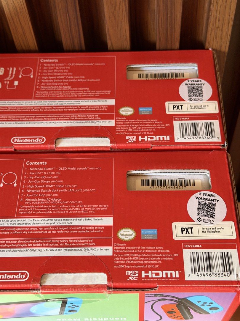 Nintendo Switch OLED Model Neon Blue and Neon Red (Category: Nintendo) located in Caloocan City. Submitted by acvalloyas (Listing ID 1468455638, Image 2). Description: - Brand new & 100% unopened Nintendo Switch OLED (Neon Blue / Neon Red Joy-Cons) - Official Southeast Asia (SEA) set with 2-year warranty stickers on the box - Serial numbers clearly printed on the back for your peace of mind - Complete standard bundle includes: Nintendo Switch con