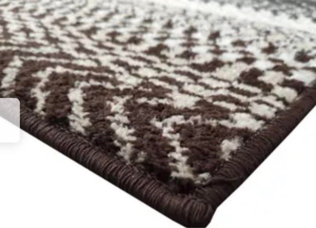 NITORI JAPANESE CARPET (Category: Carpets, Mats & Flooring) located in Manila. Submitted by jcb_1219 (Listing ID 1468432485, Image 2). Description: - Design: Stylish chevron and geometric patterns - Colors: Warm brown, cream, and dark grey tones - Quality: Thick woven construction with neatly bound edges - Size: Standard rectangular, ideal for living rooms or bedrooms - Condition: Clean, textured finish, rolled up and ready for collection.
