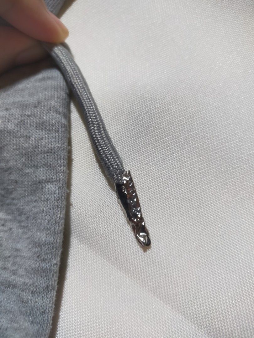 No Comment Gray Cropped Zip-Up Hoodie (Category: Coats, Jackets and Outerwear) located in Santo Tomas. Submitted by zenzenzennaya (Listing ID 1468295496, Image 3). Description: - Brand: No Comment - Size: XS - Color: Gray - Fit: Cropped with ribbed waistband and cuffs - Details: Full front zipper, attached hood, and drawstrings with metallic silver aglets (small issue on other aglet. see pics for more deets) not used/unused .