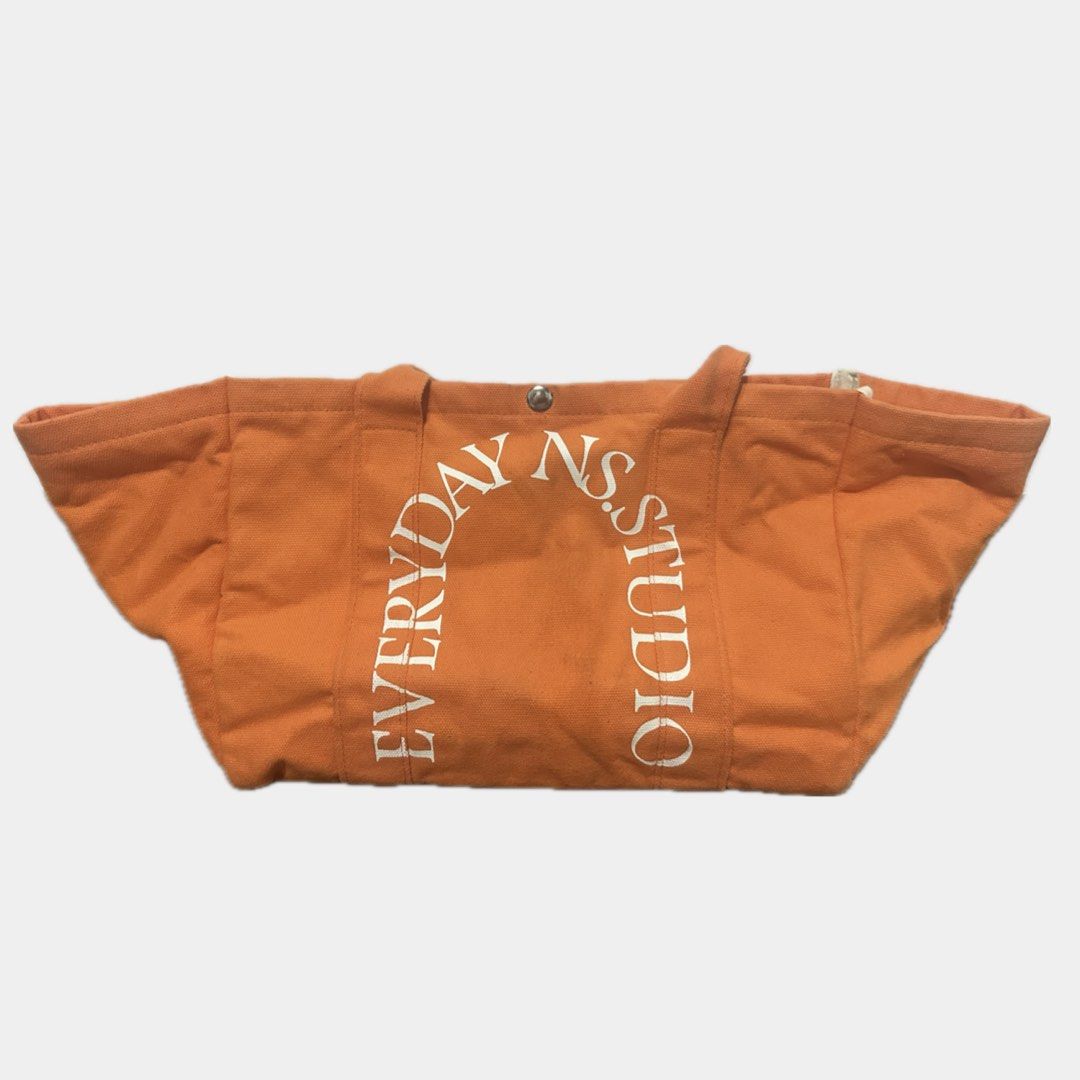 NS Studio summer tote bag in Tangerine (Category: Tote Bags) located in Paranaque City. Submitted by annvzsn (Listing ID 1468498214, Image 1). Description: Color: tangerine Size: regular/normal Material: canvas Bought in: Thailand Condition: like new Details: - Ideal for everyday use - Fits essentials easily - Snap button closure - Inner pocket - Structured base ♡ Never used this honestly, it just got wrinkled for how badly I stored it but using 