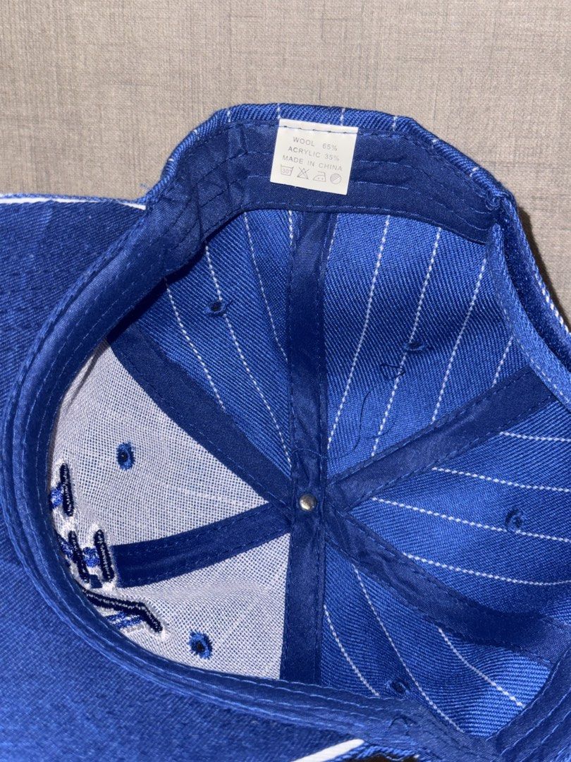 NY PINSTRIPE BASEBALL CAP – ROYAL BLUE / WHITE (Category: Caps & Hats) located in Las Pinas. Submitted by coolthreadz (Listing ID 1468403253, Image 2). Description: 🧢 NY PINSTRIPE BASEBALL CAP – ROYAL BLUE / WHITE 🏷️ Brand: Unbranded / NY Design 🧢 Style: Pinstripe Baseball Cap 🎨 Color: Royal Blue / White 📏 Size: Not Indicated 🧵 Material: 65% Wool, 35% Acrylic ✨ Condition: Very Good / Preloved * Classic New York-inspired baseball cap featuri
