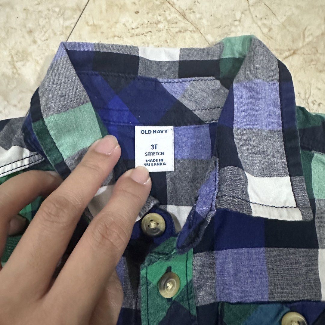 Old Navy Boys Plaid Button Down Shirt Size 3T (Category: Babies & Kids Fashion) located in Kawit. Submitted by wevibevintage (Listing ID 1468464767, Image 3). Description: - Brand: Old Navy - Size: 3T - Pattern: Classic green, blue, navy, and white plaid - Material: 97% cotton, 3% spandex for a comfortable stretch - Features: Long sleeves, collar, single chest pocket, and button cuffs - Condition: Excellent/Ready to wear.
