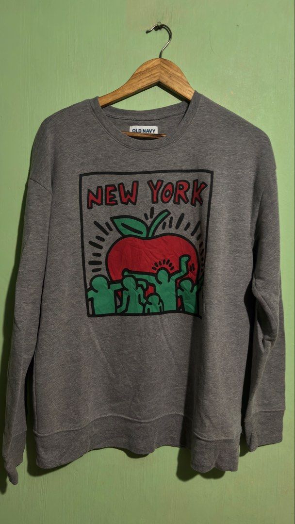 Old Navy New York Graphic Sweatshirt Gray Medium (Category: Coats, Jackets and Outerwear) located in Baguio. Submitted by iconicsmeti (Listing ID 1468424069, Image 1). Description: - Brand: Old Navy - Size: Medium - Color: Gray - Design: Big red apple graphic with green figures and red New York lettering - Style: Crew neck, long sleeves, ribbed cuffs and hem - Material: Comfortable cotton blend - Condition: Excellent, ideal for casual everyday we