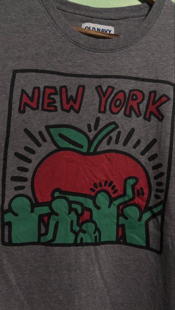 Old Navy New York Graphic Sweatshirt Gray Medium (Category: Coats, Jackets and Outerwear) located in Baguio. Submitted by iconicsmeti (Listing ID 1468424069, Image 3). Description: - Brand: Old Navy - Size: Medium - Color: Gray - Design: Big red apple graphic with green figures and red New York lettering - Style: Crew neck, long sleeves, ribbed cuffs and hem - Material: Comfortable cotton blend - Condition: Excellent, ideal for casual everyday we