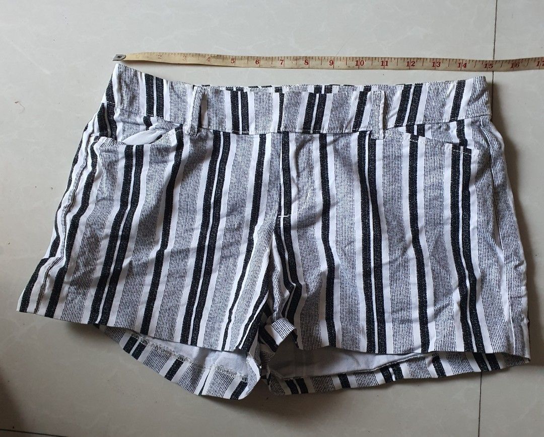 Old Navy Pixie Mid-Rise Black White Striped Shorts (Category: Shorts) located in Meycauayan. Submitted by shoptoown (Listing ID 1468308734, Image 2). Description: - Brand/Style: Old Navy Pixie Mid-Rise Tall shorts - Pattern: Classic black and white vertical stripes - Features: Front pockets, back welt pockets, and belt loops - Fit: Mid-rise - Condition/Notes: Laid flat measurements shown in photos - Styling: Great casual piece for warm weather, e