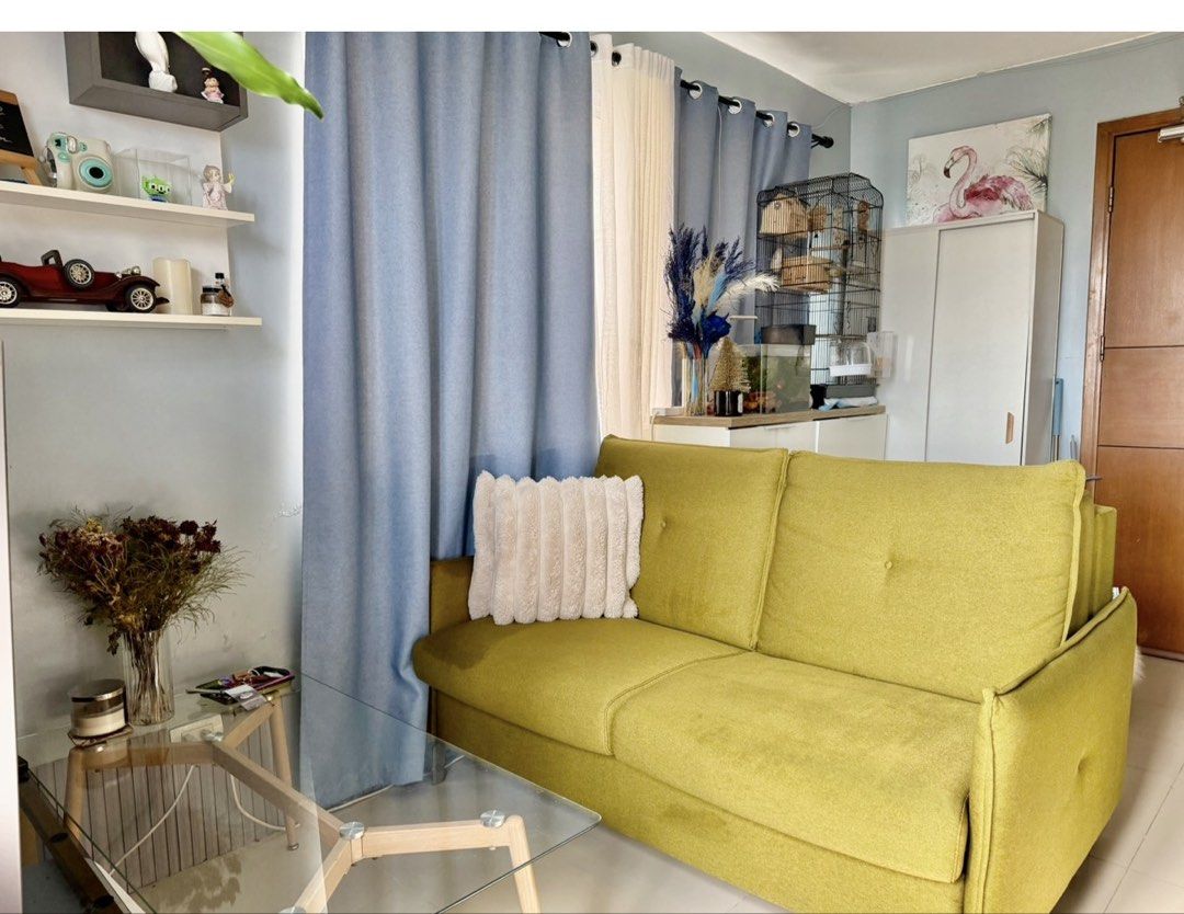 Olive green convertible sofa bed with pull-out mattress (Category: Sofas) located in Taguig. Submitted by manilafortrealty.ph (Listing ID 1468317428, Image 1). Description: For sale 2 seater Italian sofa bed Price at 250k if brand new just selling it 25k -with mattress - Color: Stylish olive green - Capacity: Seats 2 comfortably - Function: Converts easily into a proper bed - Mattress: Includes a built-in quilted mattress with a smooth metal pull