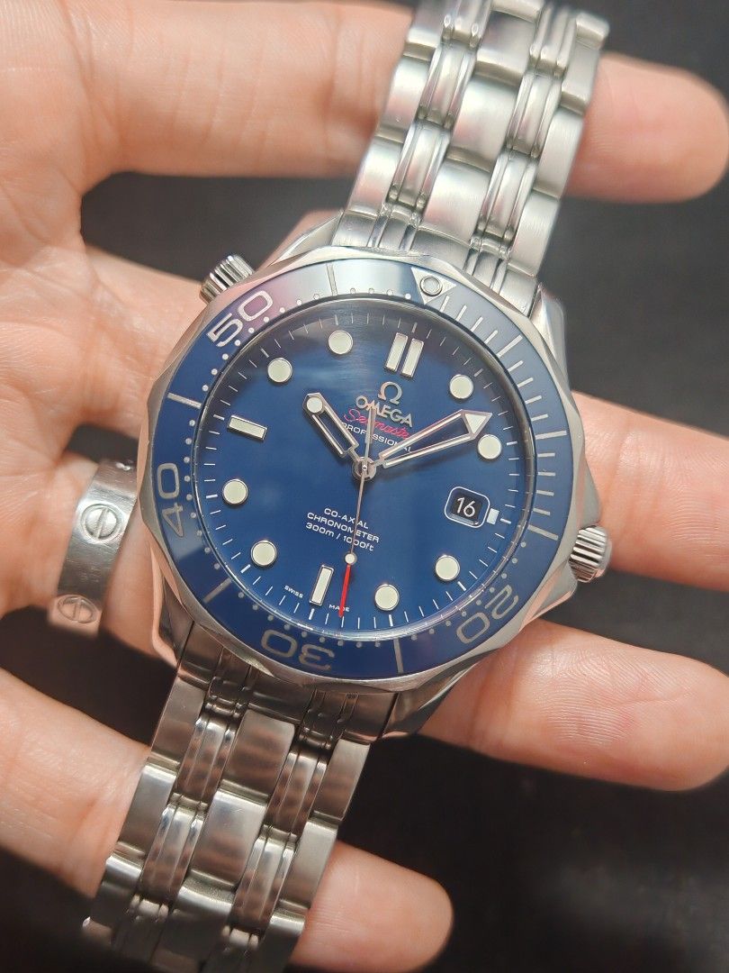 Omega Seamaster 300 Blue 41mm (Category: Men's Watches) located in San Juan City. Submitted by MW_888 (Listing ID 1468091150, Image 1). Description: 2013 Omega Seamaster 300 41mm More desirable 'non wave dial' Blue dial Ref 2123.04 9/10 condition Inclusions: watch, original steel bracelet fit to approx 7.5" wrist, guarantee card, pictograms, card holder and original box *photo reference on 6.5" wrist 195k.