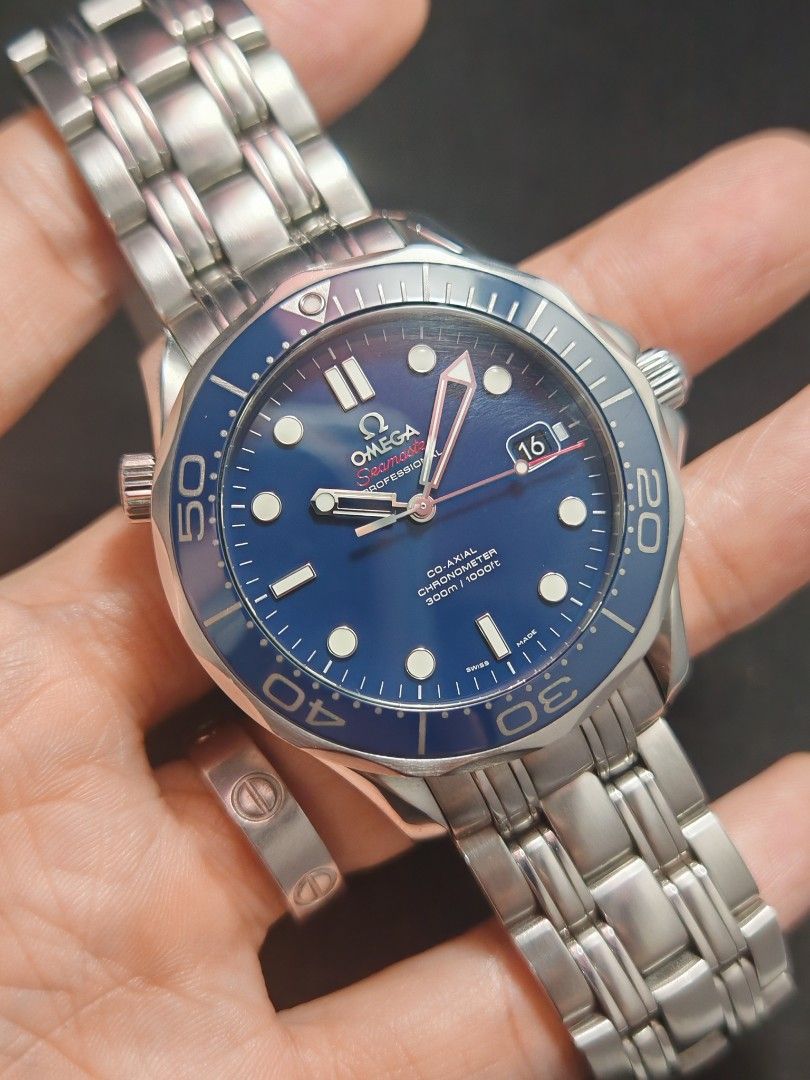 Omega Seamaster 300 Blue 41mm (Category: Men's Watches) located in San Juan City. Submitted by MW_888 (Listing ID 1468091150, Image 2). Description: 2013 Omega Seamaster 300 41mm More desirable 'non wave dial' Blue dial Ref 2123.04 9/10 condition Inclusions: watch, original steel bracelet fit to approx 7.5" wrist, guarantee card, pictograms, card holder and original box *photo reference on 6.5" wrist 195k.