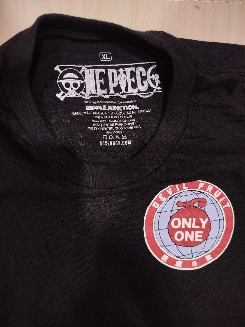 One Piece Devil Fruit Long Sleeve (Category: Coats, Jackets and Outerwear) located in Aroroy. Submitted by dr0p-a-dr1p (Listing ID 1468331053, Image 3). Description: Width: 23 Length: 28 - Official One Piece anime merchandise by Ripple Junction & BoxLunch - Size: XL - Color: Black - Material: 100% cotton (Made in Nicaragua) - Features: Devil fruit graphics on chest, sleeve, and back - Condition: Excellent, no major flaws or wear on fabric.