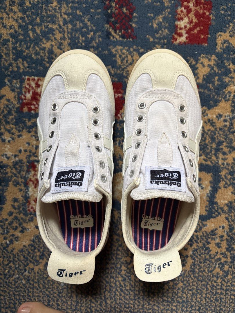 Onitsuka Tiger Mexico 66 White Slip On (Category: Sneakers) located in Taguig. Submitted by raedeclutters (Listing ID 1468330706, Image 1). Description: • Size: 22.5 cm/36 • Material: Synthetic fiber & synthetic leather upper with rubber sole • Origin: Made in Indonesia • Details: Heel pull tab with printed branding, clean overall shape • Bought in Indonesia .