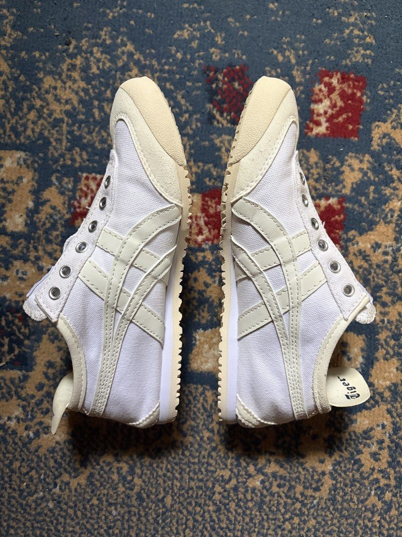 Onitsuka Tiger Mexico 66 White Slip On (Category: Sneakers) located in Taguig. Submitted by raedeclutters (Listing ID 1468330706, Image 3). Description: • Size: 22.5 cm/36 • Material: Synthetic fiber & synthetic leather upper with rubber sole • Origin: Made in Indonesia • Details: Heel pull tab with printed branding, clean overall shape • Bought in Indonesia .
