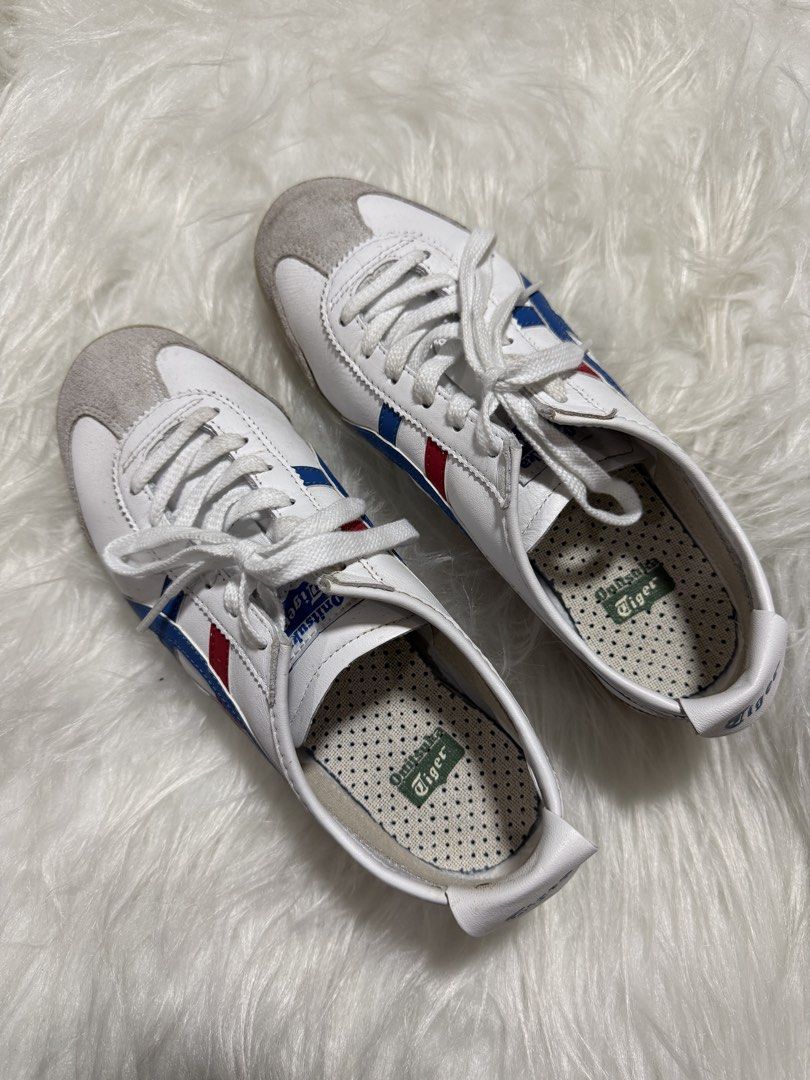 Onitsuka Tiger Mexico 66 White Blue Red (Category: Sneakers) located in Las Pinas. Submitted by juls_mp (Listing ID 1468378245, Image 1). Description: - Brand: Onitsuka Tiger - Model: Mexico 66 - Colorway: White with iconic blue and red stripes - Size: US 6.5 / EU 39.5 / UK 5.5 / CM 25.0 - Features: Low-top silhouette, suede toe overlays, unique polka dot insoles, clean white laces - Condition/Details: Crisp branding on tongue and heel flap, made
