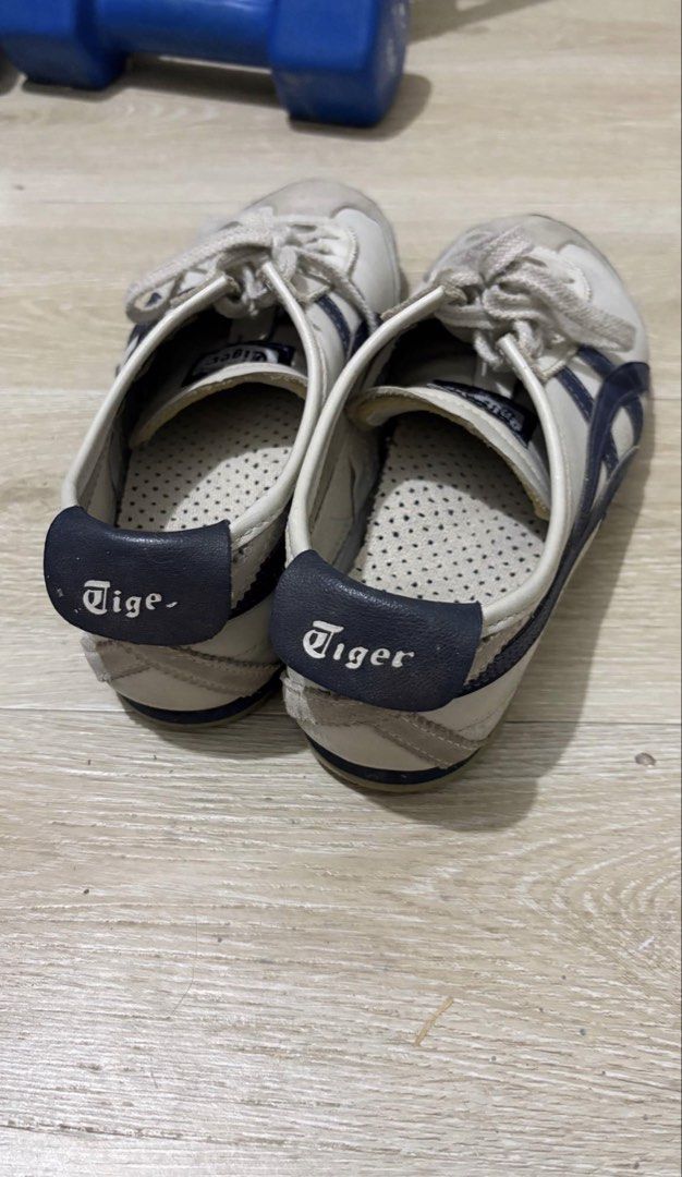Onitsuka Tiger Mexico 66 White Navy (Category: Sneakers) located in Manila. Submitted by me.declut (Listing ID 1468460084, Image 2). Description: - Brand: Onitsuka Tiger - Size: 7.5 US - Model: Mexico 66 - Colorway: White with Navy Blue and iconic blue stripes - Material: Premium leather upper with suede trim on toe and heel - Features: Classic low-top design, perforated insoles, laces included - Condition: Pre-loved, shows gentle creasing on upp