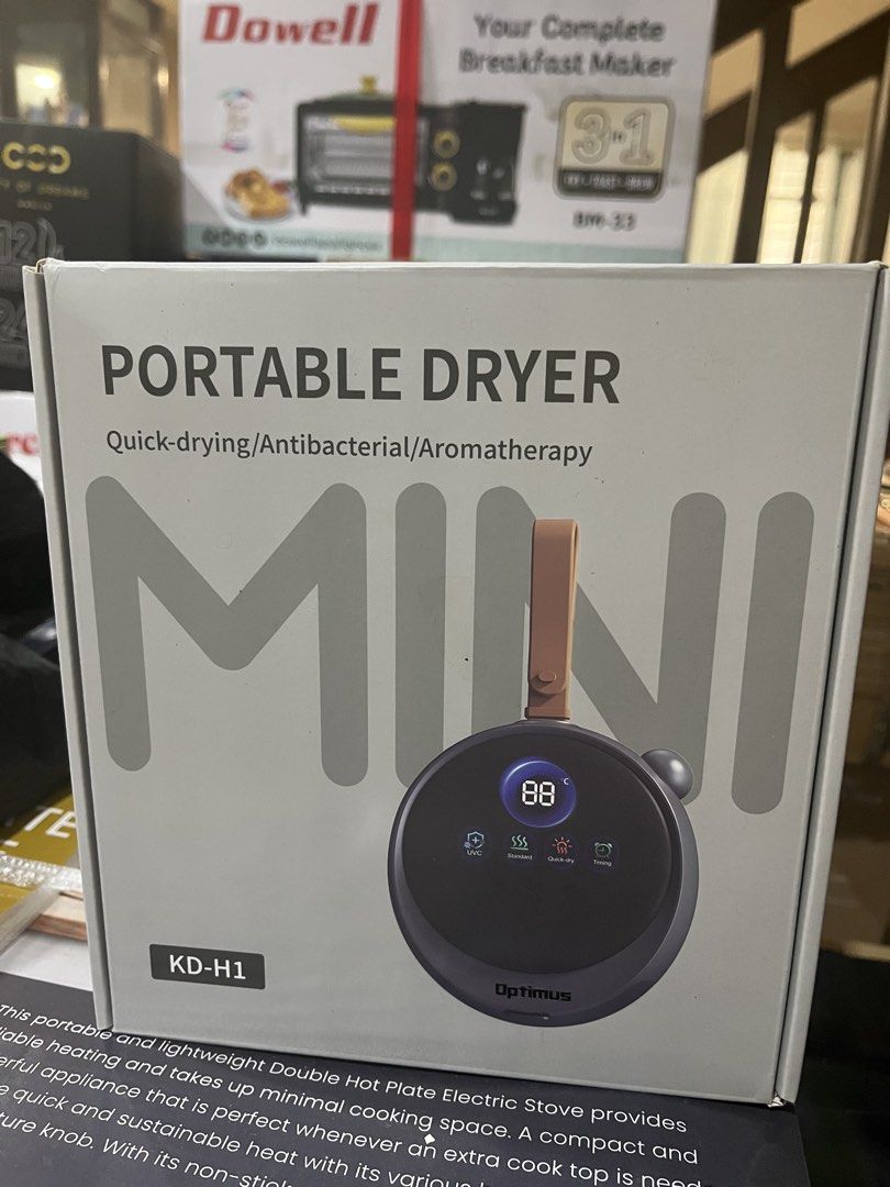 Optimus Mini Portable Dryer KD-H1 (Category: Washing Machines and Dryers) located in Manila. Submitted by jericho_chan (Listing ID 1468427099, Image 1). Description: - Model: KD-H1 Portable Dryer - Power: 200W (110V/220V dual compatibility) - Key Functions: Quick-drying, antibacterial, sterilization, mite control, and odor removal - Extra Feature: Built-in aromatherapy - Design: Compact travel size with digital display and convenient strap handle