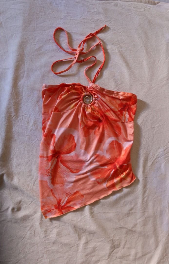 Orange Floral Halter Top Asymmetrical Hem O-Ring (Category: Sleeveless) located in Manila. Submitted by imama23 (Listing ID 1468347616, Image 2). Description: - Color/Pattern: Bright orange with red hibiscus floral print - Material: Lightweight and stretchy for a comfortable fit - Condition: Excellent, worn only once Size: XS-S Location: Manila 📦 SHIPPING • Full payment before shipping • NCR: J&T (1–3 days) / Grab or Lalamove (same-day) • Provin