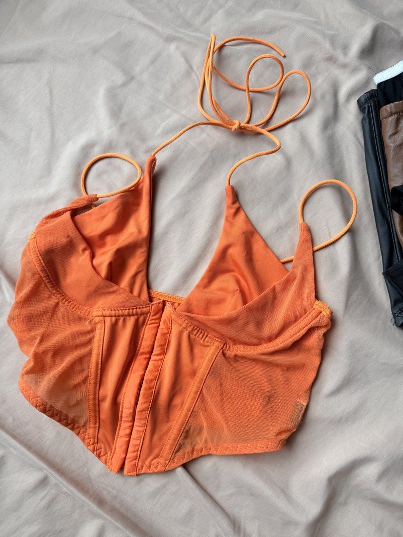 Orange Halter Corset Crop Top with Mesh Panels (Category: Sleeveless) located in Manila. Submitted by lucipurrpreloved (Listing ID 1468329161, Image 1). Description: - Color: Vibrant bright orange - Design: Halter neck with lace-up straps and sweetheart neckline - Details: Mesh side panels, structured bodice with boning, front hook-and-eye closure - Style: Trendy crop top, perfect for night outs and parties.