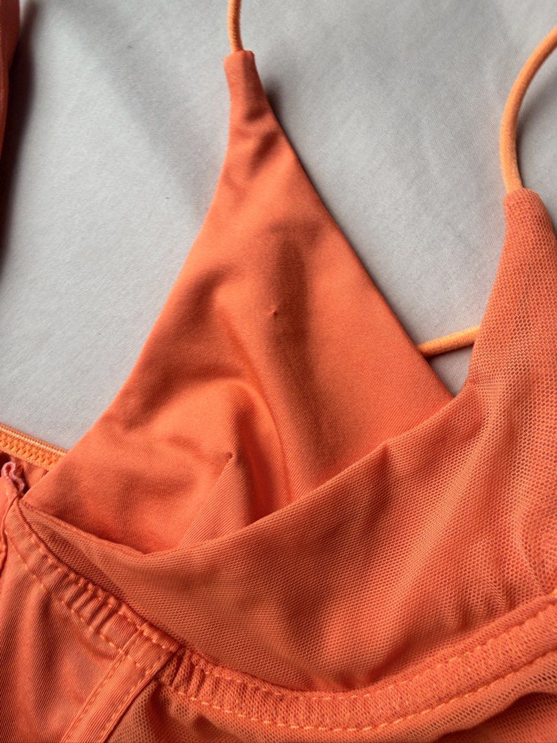 Orange Halter Corset Crop Top with Mesh Panels (Category: Sleeveless) located in Manila. Submitted by lucipurrpreloved (Listing ID 1468329161, Image 3). Description: - Color: Vibrant bright orange - Design: Halter neck with lace-up straps and sweetheart neckline - Details: Mesh side panels, structured bodice with boning, front hook-and-eye closure - Style: Trendy crop top, perfect for night outs and parties.
