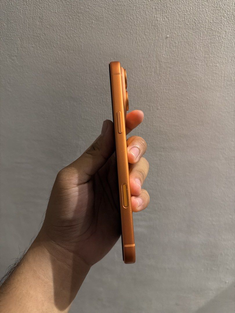 Orange iPhone replica with box (Category: iPhone 17 Series) located in Paranaque City. Submitted by jonald111 (Listing ID 1468496171, Image 2). Description: Iphone 17 Pro Max 512gb Ntc Approved Factory Unlocked Cosmic Orange Complete Package.