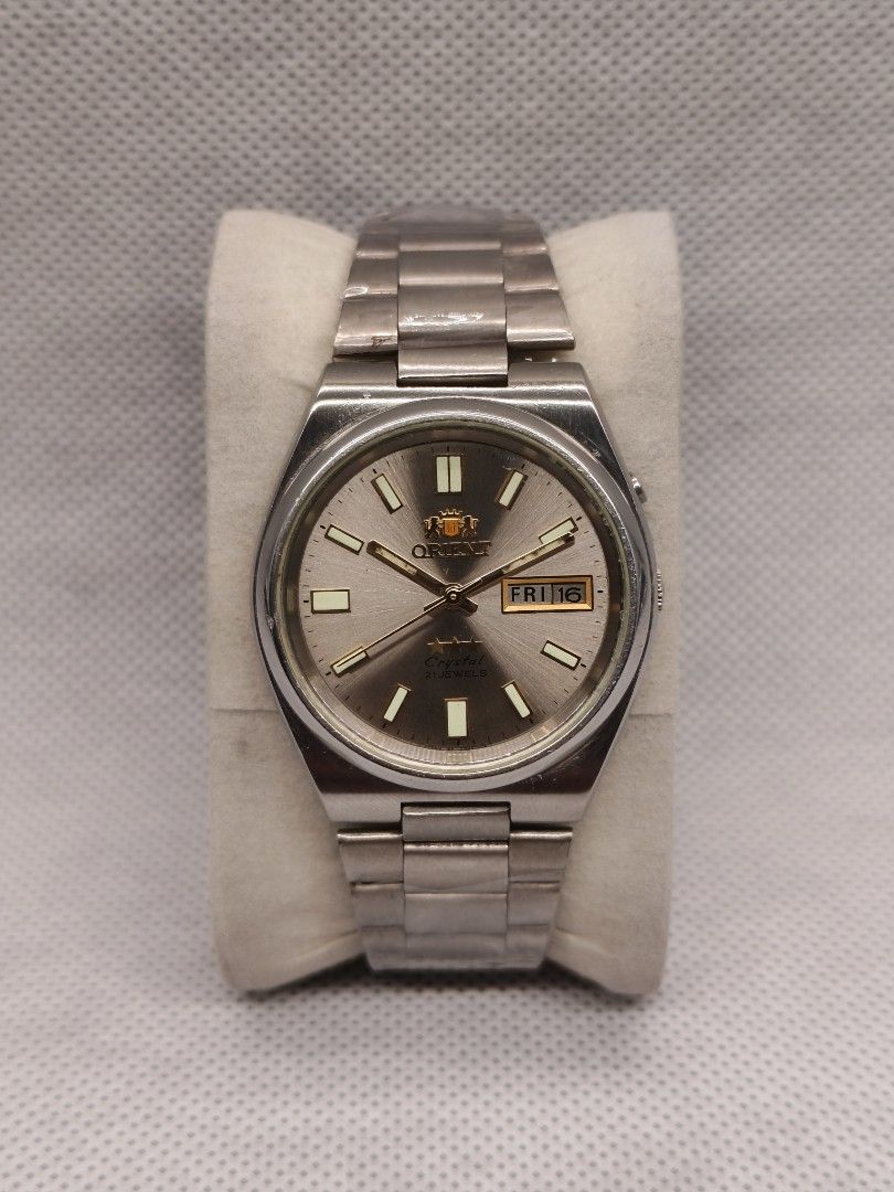 Orient "3 Star" Crystal Automatic SEM1T018K8 (Category: Men's Watches) located in Pasig City. Submitted by timepiece-and-co (Listing ID 1468400661, Image 1). Description: Key Characteristics: Brand: Orient (Made in Japan) Line: Tri-Star / 3 Star Crystal Movement: 21 Jewels Automatic (self-winding mechanical movement) Features: A day/date calendar window at the 3 o'clock position and an integrated stainless steel bracelet.