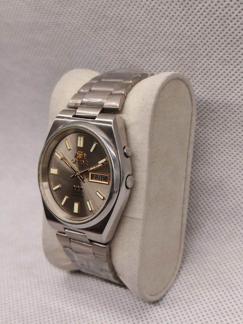 Orient "3 Star" Crystal Automatic SEM1T018K8 (Category: Men's Watches) located in Pasig City. Submitted by timepiece-and-co (Listing ID 1468400661, Image 3). Description: Key Characteristics: Brand: Orient (Made in Japan) Line: Tri-Star / 3 Star Crystal Movement: 21 Jewels Automatic (self-winding mechanical movement) Features: A day/date calendar window at the 3 o'clock position and an integrated stainless steel bracelet.