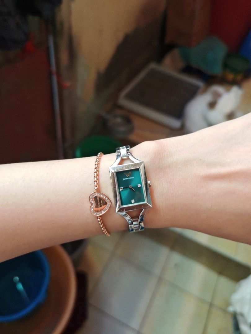 Orig Emporio Armani Teal Dial Watch (Category: Women's Watches) located in Taguig. Submitted by mystuff4youph (Listing ID 1468361421, Image 1). Description: - Brand: Emporio Armani - Original - Dial: Teal mother-of-pearl with crystal hour markers - Case: Rectangular silver-tone - Strap: Silver metal mixed with teal leather (Note: shows some wear on leather near the link connections but minimal only) - minimal scratches sa metal pero smooth glass 