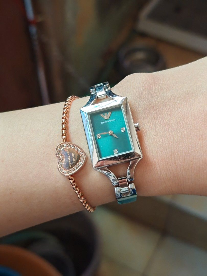 Orig Emporio Armani Teal Dial Watch (Category: Women's Watches) located in Taguig. Submitted by mystuff4youph (Listing ID 1468361421, Image 2). Description: - Brand: Emporio Armani - Original - Dial: Teal mother-of-pearl with crystal hour markers - Case: Rectangular silver-tone - Strap: Silver metal mixed with teal leather (Note: shows some wear on leather near the link connections but minimal only) - minimal scratches sa metal pero smooth glass 