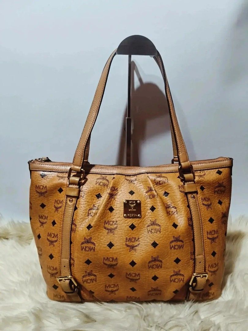Original MCM Cognac Tote bag (Category: Shoulder Bags) located in Cabuyao City. Submitted by secondhand.shop.ph (Listing ID 1468444682, Image 1). Description: Sale❗️Sale❗️Sale❗️ Original MCM Medium PVC/ genuine leather trim 📌First to pay!.