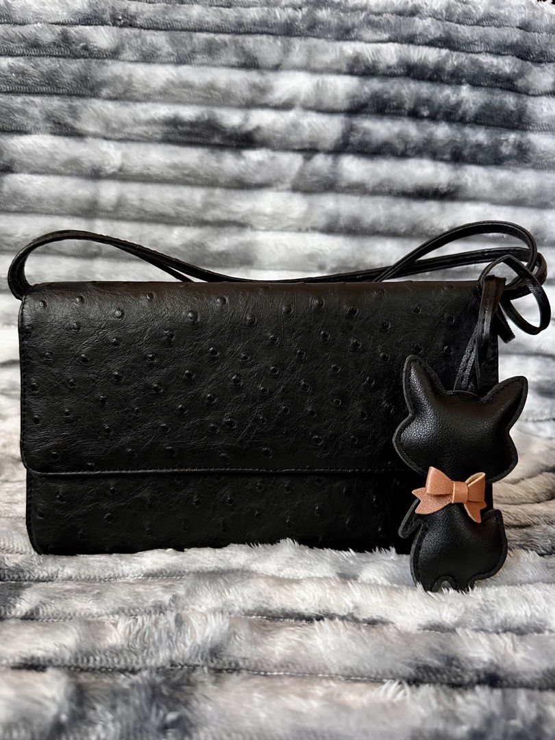 Ostrich Embossed Leather Bag (Category: Shoulder Bags) located in Bacoor. Submitted by jianne_preloved (Listing ID 1468390145, Image 1). Description: Selling my ostrich embossed leather bag with cat charm. Price is slightly negotiable, but no lowball offers please. Serious buyers only 🤗 ✨ ITEM DETAILS: • Brand: None • Color/Hardware: Black w/ silver hardware • Material: Genuine leather • Condition: Like New - No flaws 🔎 CONDITION NOTES: • Exter