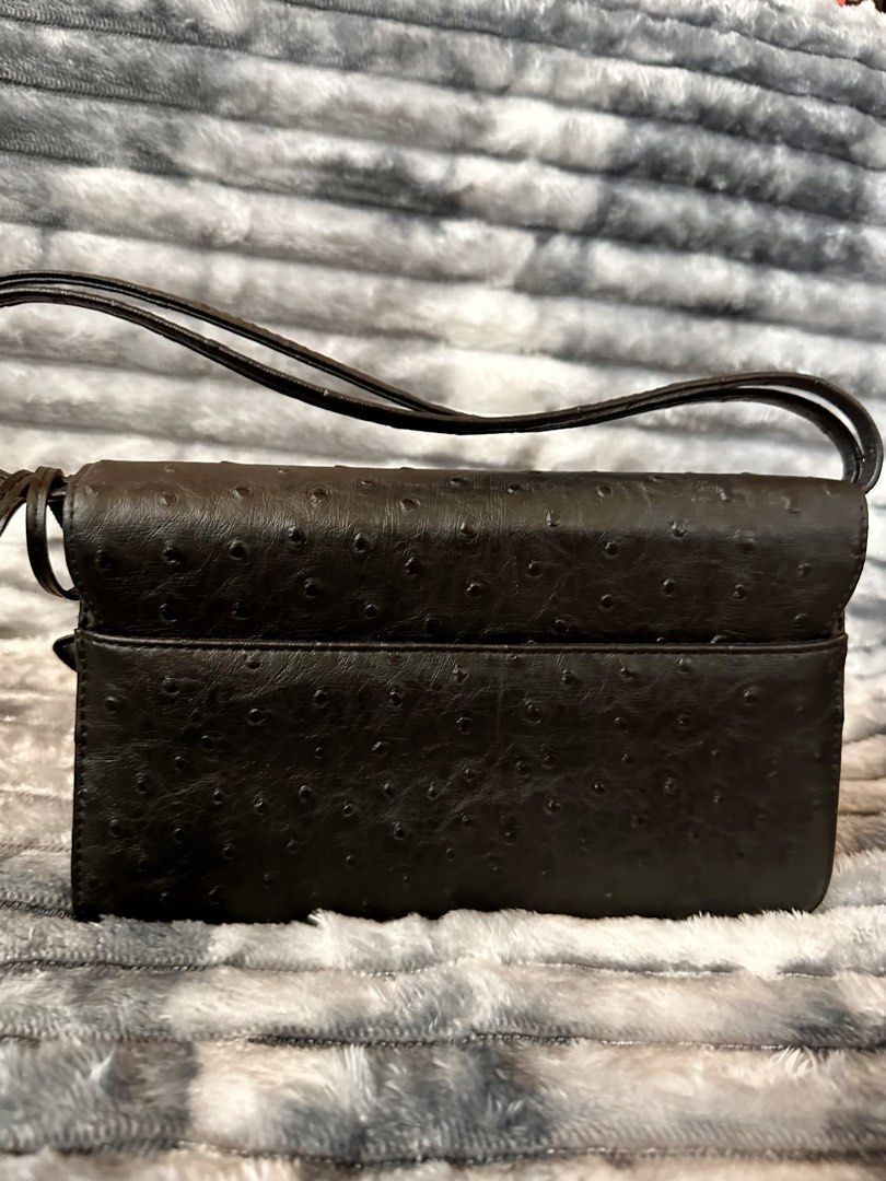 Ostrich Embossed Leather Bag (Category: Shoulder Bags) located in Bacoor. Submitted by jianne_preloved (Listing ID 1468390145, Image 3). Description: Selling my ostrich embossed leather bag with cat charm. Price is slightly negotiable, but no lowball offers please. Serious buyers only 🤗 ✨ ITEM DETAILS: • Brand: None • Color/Hardware: Black w/ silver hardware • Material: Genuine leather • Condition: Like New - No flaws 🔎 CONDITION NOTES: • Exter