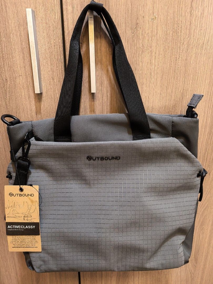 OUTBOUND Activeclassy Grey Tote Bag (Category: Tote Bags) located in Manila. Submitted by maifabfinds (Listing ID 1468460156, Image 1). Description: - Brand new with tag still attached - Stylish grey grid pattern design - Secure zippered main compartment and dual top handles - Interior padded laptop sleeve with velcro strap - Front zippered pocket with small branded logo - Durable fabric, ideal daily carry size for work or school.