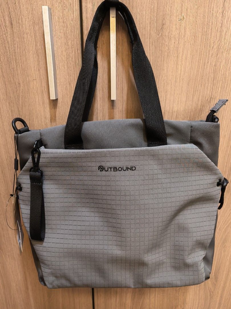 OUTBOUND Activeclassy Grey Tote Bag (Category: Tote Bags) located in Manila. Submitted by maifabfinds (Listing ID 1468460156, Image 2). Description: - Brand new with tag still attached - Stylish grey grid pattern design - Secure zippered main compartment and dual top handles - Interior padded laptop sleeve with velcro strap - Front zippered pocket with small branded logo - Durable fabric, ideal daily carry size for work or school.