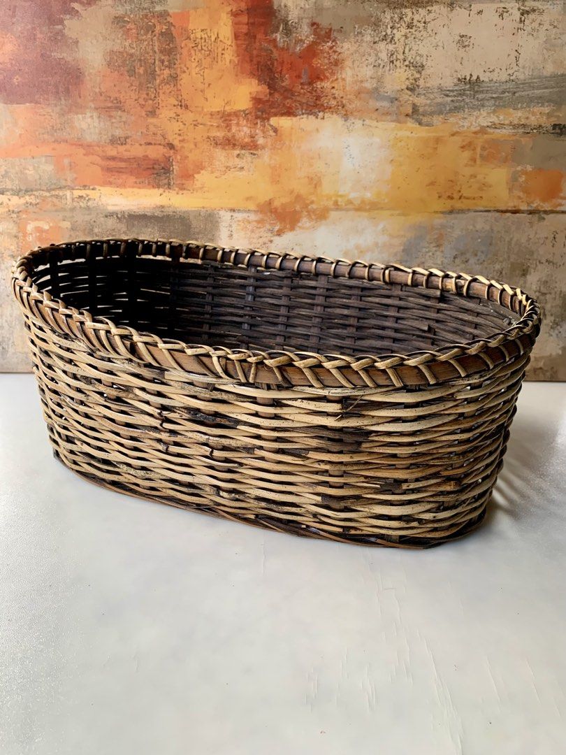 Oval Handwoven Rattan or Wicker Storage (Category: Storage Boxes & Baskets) located in Tandag. Submitted by jeason_22 (Listing ID 1468338692, Image 1). Description: oval handwoven rattan or wicker storage basket featuring a braided rim and two-tone brown and natural weave. .